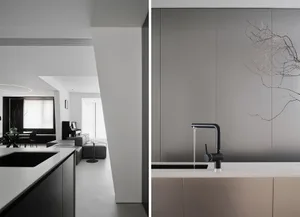 Modern minimalist kitchen featuring concrete countertops and minimalist design elements.