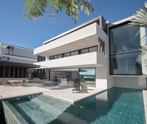 A modern residential exterior featuring concrete and glass materials.
