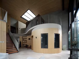 A modern residential staircase designed in wood materials