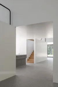 Modern interior space featuring concrete and wooden elements