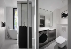 Modern bathroom suite featuring glass enclosure and metallic fixtures.