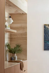 Modern interior living space featuring neutral-toned materials and minimalist design.