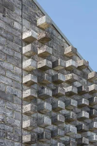 Abstract brick wall texture featuring irregular stone blocks and modern design elements.
