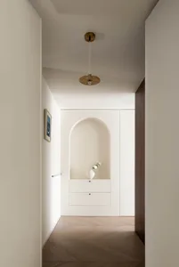 An image of a modern interior featuring concrete and wooden elements.