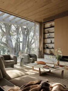 A modern living room featuring marble and wooden elements.