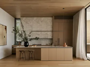 Modern kitchen with wooden cabinets and marble countertops