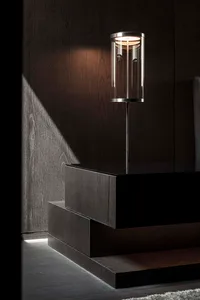 Minimalist bedroom with modern lighting fixtures and wooden elements.