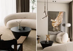 A minimalist living room with a white textured sofa, black coffee table, and modern lighting fixtures.