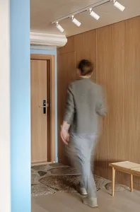 A minimalist interior featuring wood paneling.