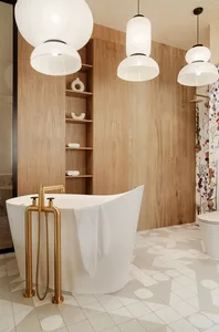 A modern bathroom with wooden accents and hanging lantern lights.