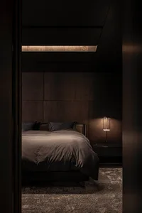 A modern minimalist bedroom featuring dark wood walls, fabric bedding, and a carpet floor.