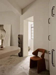 Modern residential interior featuring concrete materials and minimalistic design.