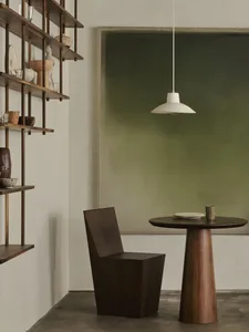 Modern furniture setting featuring wooden elements and geometric shapes.