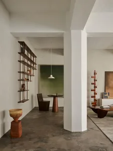 A modern living room featuring wood and concrete elements.