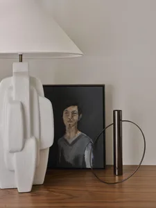 Portrait painting featuring a person on a black background.