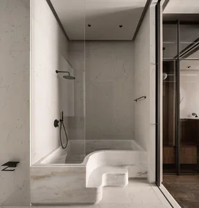 A modern minimalist bathroom with marble walls and floor, featuring a built-in bathtub with a sleek glass shower enclosure an