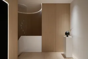 A minimalist interior design featuring wood elements.