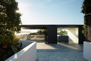 A modern house entryway featuring metal and glass materials.