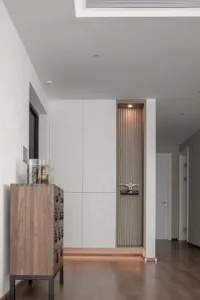 A modern entrance walkway featuring a combination of wooden and ceramic panels.