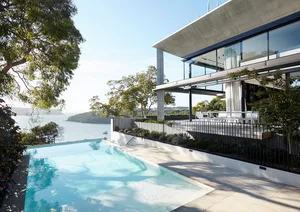 Modern house with concrete, glass, and metal materials.