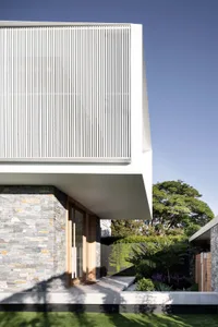 Modern house exterior with stone and metal accents