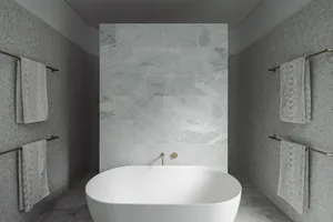 Modern bathroom with marble tiles, showcasing sleek and elegant design.