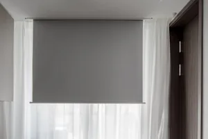 Modern window blinds and sheer white curtains in a contemporary interior design setting