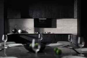 A modern minimalist kitchen with concrete countertops, black cabinets, and white appliances.