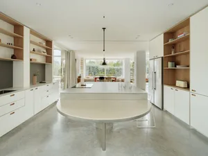 Modern minimalist retail storefront featuring a concrete floor plan and minimalist design elements.