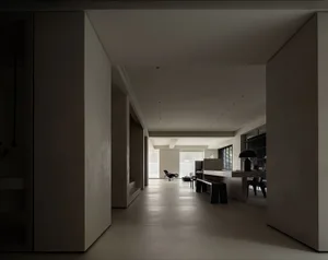 Modern interior design featuring concrete walls and floors.