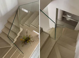 Modern glass staircase with wooden steps and minimalist design.
