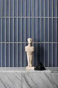 A minimalist interior design featuring marble and concrete materials.