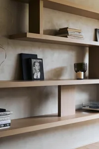 A stylish, modern interior shelf display featuring wood materials, showcasing design elements and organization.