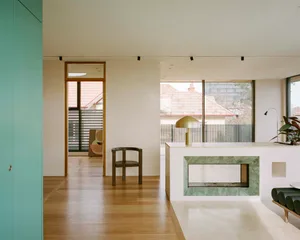 A minimalist living room featuring marble elements.