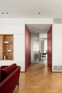 Modern office space featuring wood flooring and furniture.