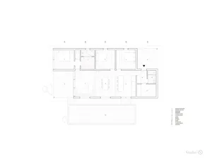 A modern residential floor plan with white lines.