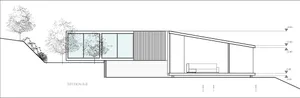 Modern house exterior with large glass windows, minimalist design, and sleek lines.