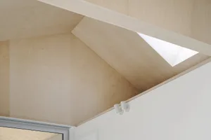 Modern interior design featuring wood-paneled ceiling