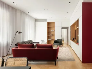Contemporary living room with minimalist design and modern furniture in mixed materials.