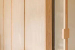 Detail of modern interior design featuring wooden paneling.