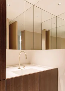 Modern minimalist bathroom featuring marble sink and countertop.