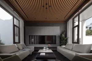 Modern industrial living room with metal accents and minimalist design.