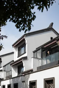A modern building with white-painted stone construction.