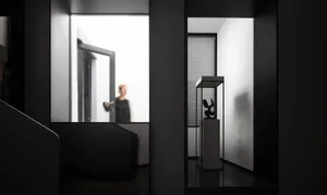Modern interior design featuring black and white color scheme and metallic elements.