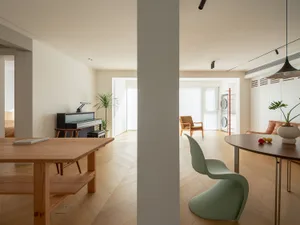 Modern living room with wooden furniture and minimalist design.