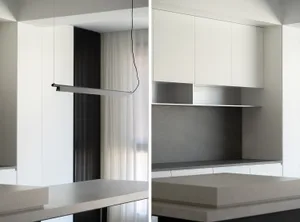 Modern kitchen with a concrete countertop and minimalist design.