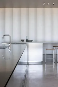 Modern kitchen featuring metallic materials and sleek design