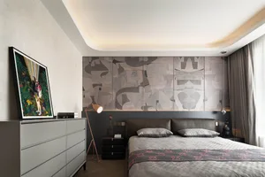 Modern bedroom with neutral tones and abstract wall design