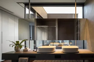 Modern minimalist bathroom with concrete and glass elements