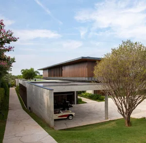 Modern house with concrete exterior and wood detailing.